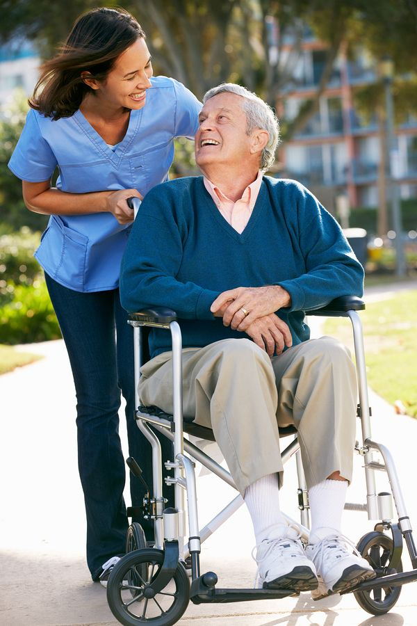 Caregiver assisting a patient at home